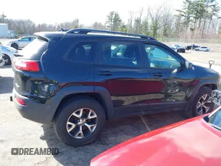 2014 Jeep Cherokee Trailhawk with VIN 1C4PJMBS3EW127749, listed as a IAAI auction lot 41836617 with 207,002 mi miles and . Bid and sale history available at DreamBid. Image 13.