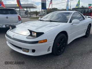 1992 Mitsubishi 3000GT z VIN JA3XE74CXNY058167, wystawiony jako Copart lot #84192254 z przebiegiem 69 411 mil mil oraz Tytuł czysty. Historia ofert i sprzedaży dostępna na DreamBid. Obrazek 2.