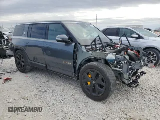 2022 Rivian R1S Launch Edition with VIN 7PDSGABL3NN000739, listed as a Copart auction lot 88127995 with 12,143 mi miles and Salvage Title. Bid and sale history available at DreamBid. Image 4.