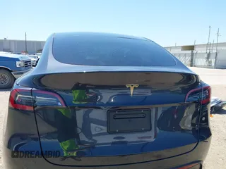 2024 Tesla Model Y with VIN 7SAYGDED2RF040745, listed as a IAAI auction lot 41986613 with 9,778 mi miles and . Bid and sale history available at DreamBid. Image 16.