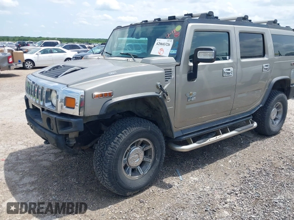 2003 Hummer H2 with VIN 5GRGN23U23H148326, listed as a IAAI auction lot 42068326 with 149,396 mi miles. Bid and sale history available at carsss.com. Image 18.