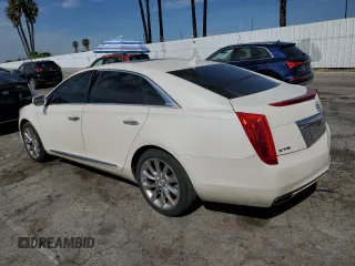 2014 Cadillac XTS Premium with VIN 2G61P5S36E9305491, listed as a Copart auction lot 44404425 with 104,710 mi miles and Salvage Title. Bid and sale history available at DreamBid. Image 2.