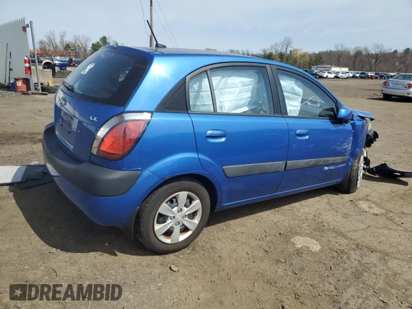 2009 Kia Rio LX with VIN KNADE243296500963, listed as a Copart auction lot 51061595 with 76,596 mi miles and Salvage Title. Bid and sale history available at carsss.com. Image 3.