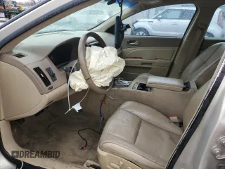 2007 Cadillac STS z VIN 1G6DW677970175897, wystawiony jako Copart lot #43030545 z przebiegiem 158 180 mil mil oraz Szkody całkowita. Historia ofert i sprzedaży dostępna na DreamBid. Obrazek 7.