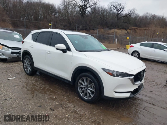 2021 Mazda CX-5 Grand Touring with VIN JM3KFADM4M1340141, listed as a IAAI auction lot 41194711 with 37,887 mi miles. Bid and sale history available at carsss.com. Image 1.