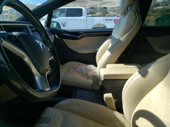 2016 Tesla Model X 70D with VIN 5YJXCAE29GF004033, listed as a Copart auction lot 49673975 with 220,259 mi miles and Salvage Title. Bid and sale history available at DreamBid. Image 7.