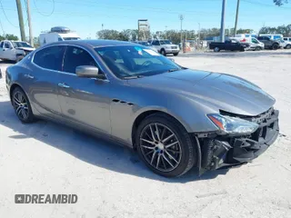 2014 Maserati Ghibli z VIN ZAM57XSA3E1083954, wystawiony jako IAAI lot #41428084 z przebiegiem 159 632 mil mil oraz . Historia ofert i sprzedaży dostępna na DreamBid. Obrazek 1.