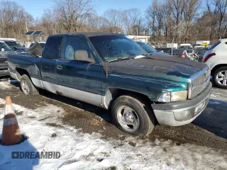 1999 Dodge 1500 with VIN 3B7HC12Y8XG208040, listed as a Copart auction lot 86807104 with 387,576 mi miles and Salvage Title. Bid and sale history available at DreamBid. Image 4.