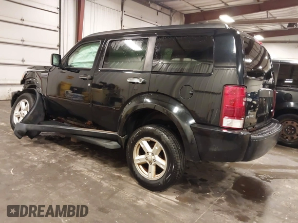 2007 Dodge Nitro SXT with VIN 1D8GU28K67W663621, listed as a IAAI auction lot 41691529 with 211,556 mi miles. Bid and sale history available at carsss.com. Image 3.