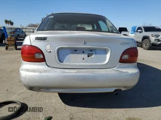 1996 Hyundai Accent z VIN KMHVF14N4TU316378, wystawiony jako Copart lot #88981945 z przebiegiem 128 650 mil mil oraz Tytuł czysty. Historia ofert i sprzedaży dostępna na DreamBid. Obrazek 6.