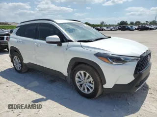 2024 Toyota Corolla Cross LE with VIN 7MUCAAAG7RV090677, listed as a Copart auction lot 57615565 with 6,910 mi miles and Salvage title. Bid and sale history available at DreamBid. Image 4.