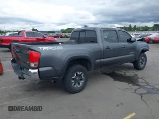 2017 Toyota Tacoma SR5 with VIN 3TMDZ5BN3HM027098, listed as a IAAI auction lot 42409977 with 97,224 mi miles and . Bid and sale history available at DreamBid. Image 4.
