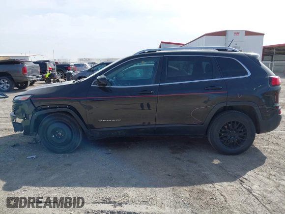 2015 Jeep Cherokee North with VIN 1C4PJMCS7FW544792, listed as a IAAI auction lot 41801573 with 140,575 mi miles. Bid and sale history available at carsss.com. Image 14.