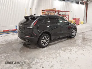 2020 Cadillac XT4 AWD Sport with VIN 1GYFZFR43LF090264, listed as a IAAI auction lot 41261586 with 65,859 mi miles and . Bid and sale history available at DreamBid. Image 4.