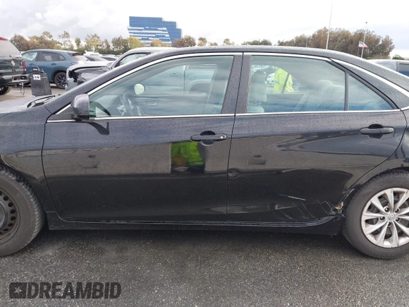 2015 Toyota Camry XLE with VIN 4T4BF1FK9FR461402, listed as a IAAI auction lot 41772628 with 92,795 mi miles and . Bid and sale history available at DreamBid. Image 14.