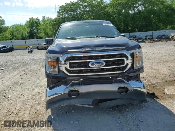 2021 Ford F-150 XL with VIN 1FTFW1E5XMFA47980, listed as a Copart auction lot 56737215 with 63,781 mi miles and Salvage title. Bid and sale history available at DreamBid. Image 13.