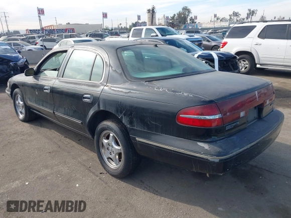 1997 Lincoln Continental with VIN 1LNLM97V5VY665410, listed as a IAAI auction lot 41239128 with 66,873 mi miles. Bid and sale history available at carsss.com. Image 3.