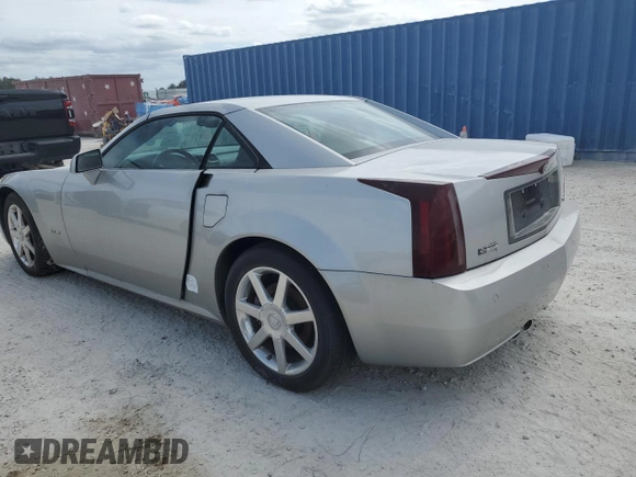 2004 Cadillac XLR z VIN 1G6YV34A945601007, wystawiony jako Copart lot #77077394 z przebiegiem Nie podano mil oraz Szkody całkowita. Historia ofert i sprzedaży dostępna na DreamBid. Obrazek 2.