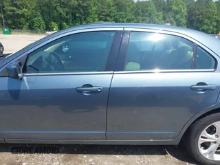 2012 Ford Fusion SE z VIN 3FAHP0HA4CR209490, wystawiony jako IAAI lot #42376506 z przebiegiem 145 622 mil mil oraz . Historia ofert i sprzedaży dostępna na DreamBid. Obrazek 14.