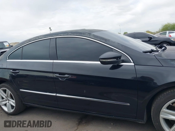 2013 Volkswagen CC Sport with VIN WVWBP7AN6DE504679, listed as a IAAI auction lot 42034362 with 148,527 mi miles. Bid and sale history available at carsss.com. Image 14.