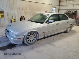 2004 Jaguar XJ with VIN SAJEA71C84SG07220, listed as a Copart auction lot 70916164 with 151,102 mi miles and Salvage Title. Bid and sale history available at carsss.com. Image 1.