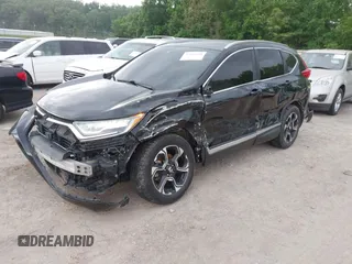 2017 Honda CR-V Touring with VIN 2HKRW2H96HH672017, listed as a IAAI auction lot 42151118 with 144,527 mi miles and . Bid and sale history available at carsss.com. Image 18.