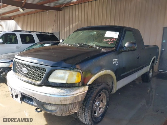 2000 Ford F-150 XL with VIN 1FTRX18LXYNA19385, listed as a IAAI auction lot 41075391 with 214,624 mi miles. Bid and sale history available at carsss.com. Image 2.