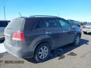 2013 Kia Sorento LX with VIN 5XYKT3A60DG379067, listed as a IAAI auction lot 41613664 with 142,651 mi miles and . Bid and sale history available at carsss.com. Image 4.
