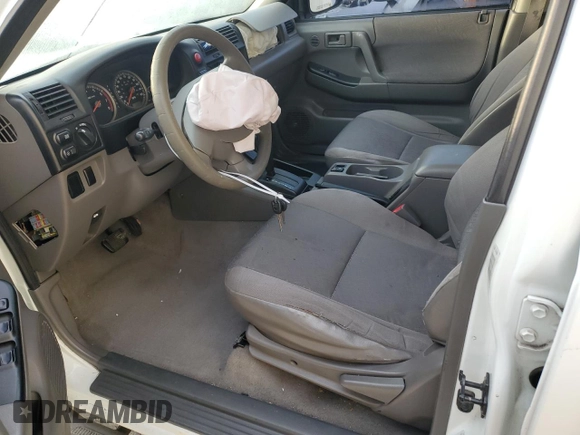 2003 Isuzu Rodeo with VIN 4S2DM58W034303129, listed as a Copart auction lot 83757734 with 114,274 mi miles and Salvage Title. Bid and sale history available at DreamBid. Image 7.