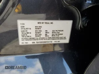 2025 Tesla Model Y Long Range with VIN 7SAYGDED8SF241779, listed as a Copart auction lot 51899205 with 12,409 mi miles and Salvage Title. Bid and sale history available at DreamBid. Image 13.
