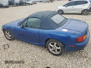 1999 Mazda MX-5 Miata with VIN JM1NB3532X0134801, listed as a Copart auction lot 83838374 with 97,015 mi miles and Salvage title. Bid and sale history available at DreamBid. Image 2.