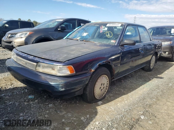 1989 Toyota Camry z VIN 4T1SV22E0KU032677, wystawiony jako Copart lot #46308555 z przebiegiem 993 896 mil mil oraz Czysty tytuł • Clean title. Historia ofert i sprzedaży dostępna na DreamBid. Obrazek 1.