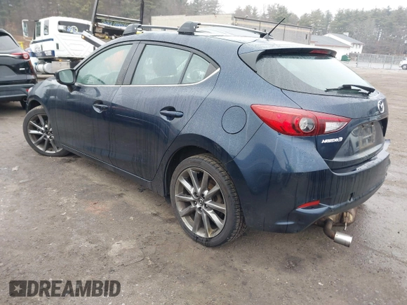 2018 Mazda 3 Touring with VIN 3MZBN1L34JM204883, listed as a IAAI auction lot 41094541 with 125,205 mi miles and . Bid and sale history available at DreamBid. Image 3.