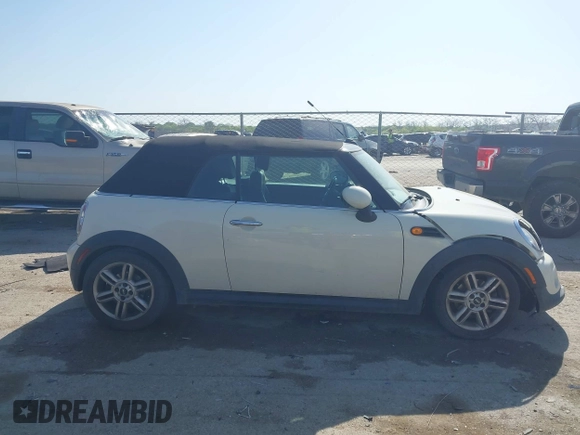 2013 MINI Convertible with VIN WMWZN3C58DT568824, listed as a IAAI auction lot 41998124 with 134,191 mi miles and . Bid and sale history available at DreamBid. Image 13.
