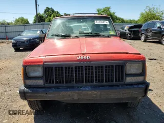 1995 Jeep Cherokee Sport with VIN 1J4FJ67S6SL549912, listed as a Copart auction lot 61104474 with 296,507 mi miles and Clean Title. Bid and sale history available at carsss.com. Image 5.