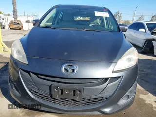 2014 Mazda 5 Sport with VIN JM1CW2BL5E0166522, listed as a IAAI auction lot 41635454 with 94,225 mi miles and . Bid and sale history available at DreamBid. Image 6.