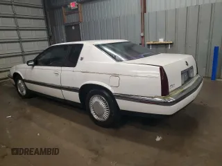 1992 Cadillac Eldorado z VIN 1G6EL13B8NU614555, wystawiony jako Copart lot #73767514 z przebiegiem 88 448 mil mil oraz Tytuł czysty. Historia ofert i sprzedaży dostępna na DreamBid. Obrazek 2.