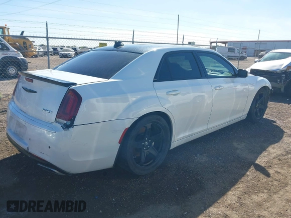 2012 Chrysler 300 SRT-8 with VIN 2C3CCAFJ9CH801749, listed as a IAAI auction lot 40912606 with 144,404 mi miles and . Bid and sale history available at DreamBid. Image 4.