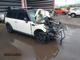 2014 MINI Clubman z VIN WMWZF3C55ET571694, wystawiony jako IAAI lot #41808698 z przebiegiem 36 694 mil mil oraz . Historia ofert i sprzedaży dostępna na DreamBid. Obrazek 1.
