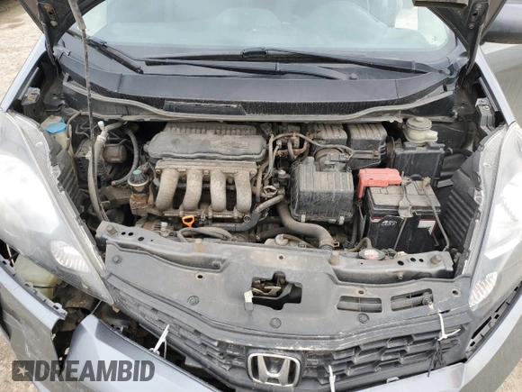2013 Honda Fit Sport z VIN LUCGE8H70D3007465, wystawiony jako Copart lot #53542045 z przebiegiem 223 335 mil mil oraz Szkoda całkowita • Salvage title. Historia ofert i sprzedaży dostępna na DreamBid. Obrazek 11.