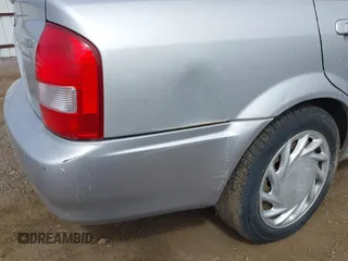2002 Mazda Protege LX z VIN JM1BJ226X20523807, wystawiony jako IAAI lot #42373241 z przebiegiem 218 634 mil mil oraz . Historia ofert i sprzedaży dostępna na DreamBid. Obrazek 6.