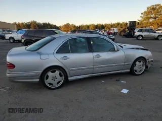 2000 Mercedes-Benz E-Class with VIN WDBJF70JXYB113988, listed as a Copart auction lot 86325514 with 198,321 mi miles and Salvage Title. Bid and sale history available at carsss.com. Image 3.