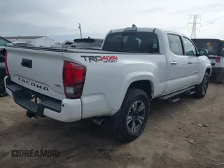 2018 Toyota Tacoma SR5 with VIN 3TMDZ5BN9JM051105, listed as a IAAI auction lot 41708034 with 98,000 mi miles and . Bid and sale history available at DreamBid. Image 4.
