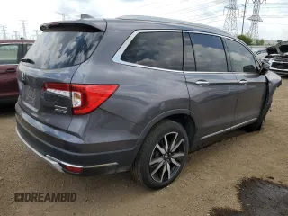 2022 Honda Pilot Touring 7-Passenger with VIN 5FNYF6H6XNB014347, listed as a Copart auction lot 56869745 with 31,513 mi miles and Salvage title. Bid and sale history available at DreamBid. Image 3.