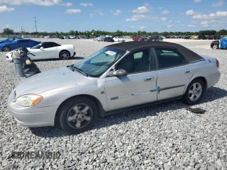 2001 Ford Taurus SES z VIN 1FAFP55S61A133943, wystawiony jako Copart lot #57051985 z przebiegiem 76 241 mil mil oraz Szkoda całkowita • Salvage title. Historia ofert i sprzedaży dostępna na DreamBid. Obrazek 1.