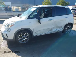 2014 FIAT 500L Trekking with VIN ZFBCFADH7EZ017515, listed as a IAAI auction lot 41431155 with 128,311 mi miles and . Bid and sale history available at DreamBid. Image 2.