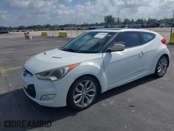 2013 Hyundai Veloster w/Gray Int with VIN KMHTC6AD0DU150516, listed as a IAAI auction lot 42164880 with 122,841 mi miles and . Bid and sale history available at DreamBid. Image 2.