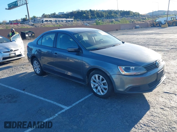 2012 Volkswagen Jetta Sedan SE w/Convenience with VIN 3VWDX7AJ7CM412976, listed as a IAAI auction lot 41823799 with 210,248 mi miles. Bid and sale history available at carsss.com. Image 1.