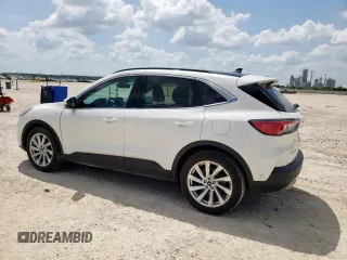 2021 Ford Escape Titanium Hybrid z VIN 1FMCU0DZ6MUA03327, wystawiony jako Copart lot #59558845 z przebiegiem 67 569 mil mil oraz Czysty tytuł • Clean title. Historia ofert i sprzedaży dostępna na DreamBid. Obrazek 2.