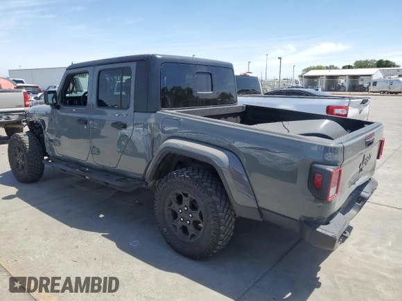 2023 Jeep Gladiator Sport S with VIN 1C6HJTAG3PL552959, listed as a Copart auction lot 56905635 with 30,356 mi miles and Salvage title. Bid and sale history available at DreamBid. Image 2.